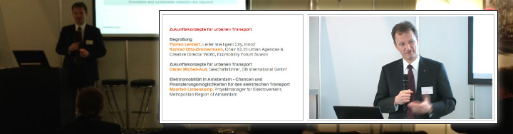Hybridkonferenz urbaner Transport: Sprecher auf Bühne links, zugeschalteter Experte per Video-Stream rechts mit Präsentation.